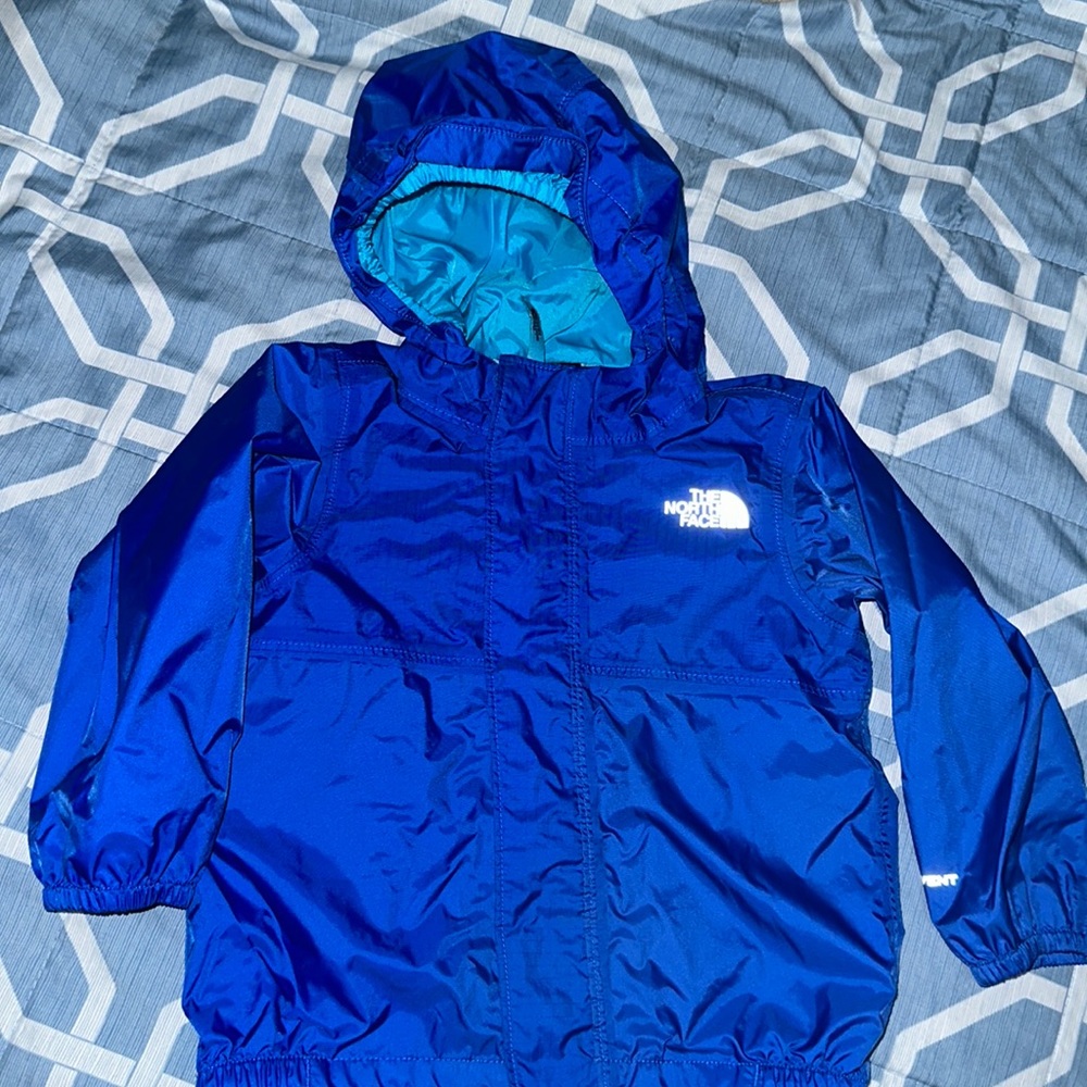 The North Face blue windbreaker jacket